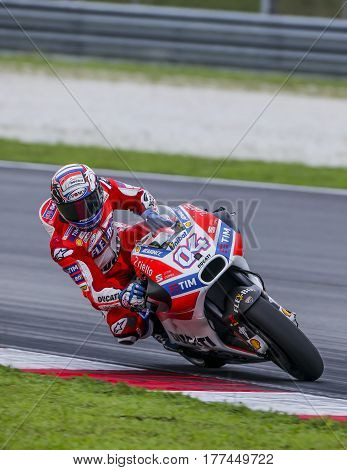 SEPANG MALAYSIA - JANUARY 30 2017 : Ducati Team rider Andrea Dovizioso taking a corner during 2017 MotoGP pre-season test at the Sepang International Circuit.
