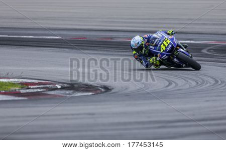 SEPANG MALAYSIA - JANUARY 30 2017 : Movistar Yamaha MotoGP rider Valentino Rossi taking a corner during 2017 MotoGP pre-season test (Winter Test) at the Sepang International Circuit.