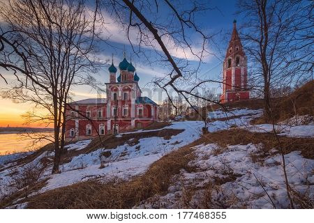 Church in the city of Tutaev. Sunset. Early spring. The snow is visible. Yaroslavl region. Russia