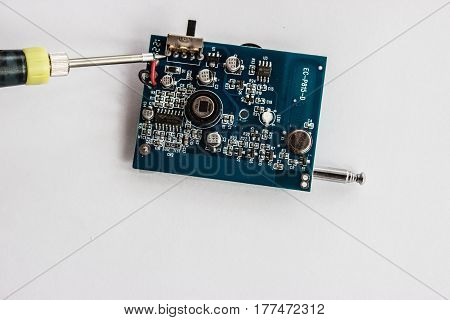 Soldering of tin of electronic componentzs on printed circuit board.