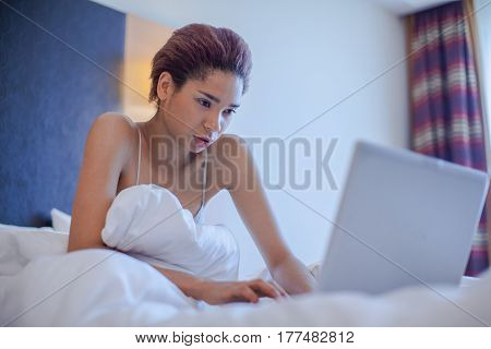 Young Black Woman Seat In Bed.