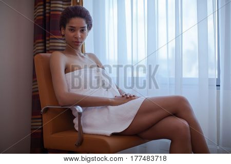 Young Beautiful Woman Sitting In The Chair Next To The Window