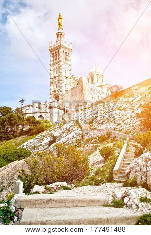 Notre-Dame de la Garde (literally Our Lady of the Guard) is a basilica in Marseille France. This ornate Neo-Byzantine church is situated at the highest natural point in Marseille.