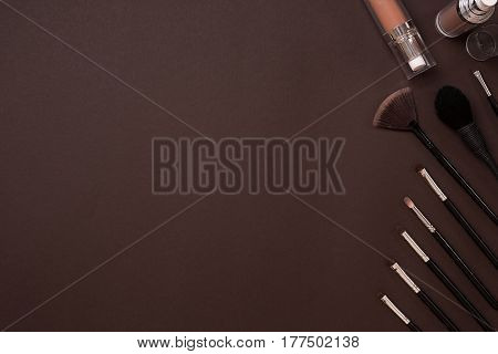 brush for makeup, eye shadow, view from above. Still life. On a brown background. Copy space