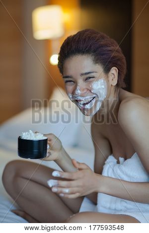 Beautiful Woman In Towel On The Bed Drinking Coffee With Whipped Cream