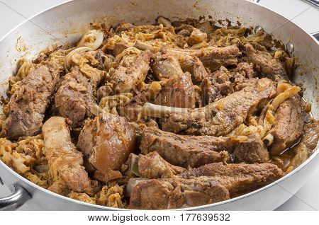 Cassoeula cassola pork meat in a pot isolated on neutral background