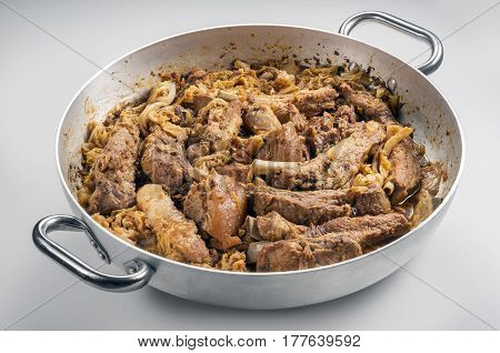 Cassoeula cassola pork meat in a pot isolated on neutral background