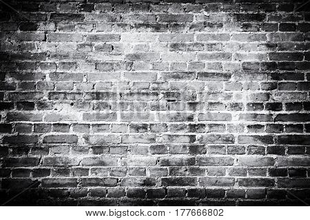 Old brick wall background. Grunge texture. Black wallpaper. Dark surface
