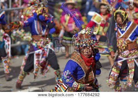 ORURO, BOLIVIA - FEBRUARY 25, 2017: Tinkus dancers in colourful costumes performing at the annual Oruro Carnival. The event is designated by UNESCO as being Intangible Cultural Heritage of Humanity.