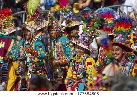 ORURO, BOLIVIA - FEBRUARY 25, 2017: Tinkus dancers in colourful costumes performing at the annual Oruro Carnival. The event is designated by UNESCO as being Intangible Cultural Heritage of Humanity.