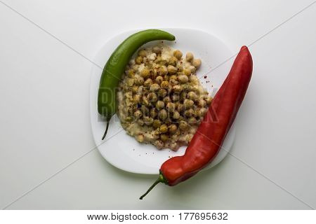 Hummus or Houmous traditional Syrian food plate mostly for breakfast.Oriental recipe. olive oil, chick peas, sesame paste, lemon, garlic, salt, cumin