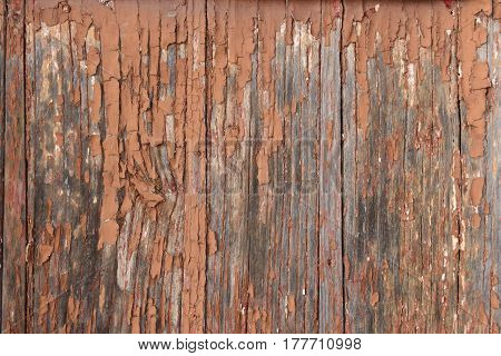 Detail of somoe remains of paint on old woodbrown