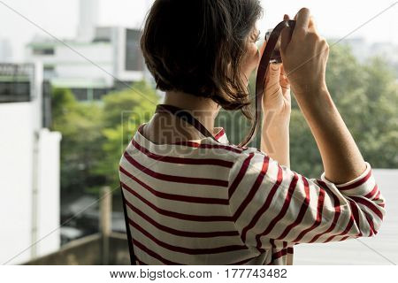 Woman traveler photographer holiday lifestyle trip
