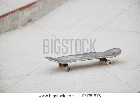 skateboard at skatepark ready for riding on concrete background
