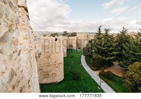 Avila Spain - November 11 2014: Cityscape of Avila from Medieval Walls a cloudy day. The old city and its extramural churches were declared a World Heritage site by UNESCO