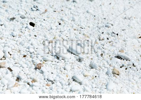 Close up of white marble stones texture  background at Saliara Beach in Thassos Island, Greece