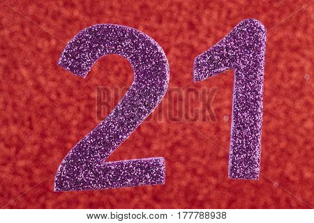 Number twenty-one purple over a red background. Anniversary. Horizontal