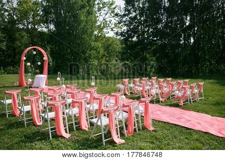 Wedding registration beautiful in nature. White chairs for visiting registration. Pink tent with white flowers for the exit registration. White and pink peonies with roses. Wedding details