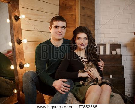 Man and woman are hugging. Happy woman hugging her husband. Happy couple at his new appartament. Black and white photo. Happiness concept.