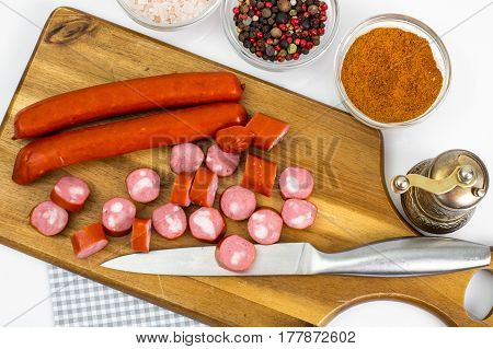 Cabbage smoked sausages on wood. Studio Photo