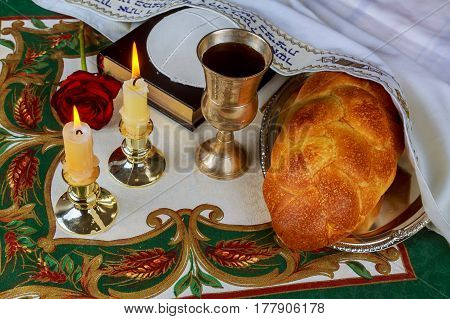 Shabbat Eve Table With Challah Bread, Candles And Kippah.