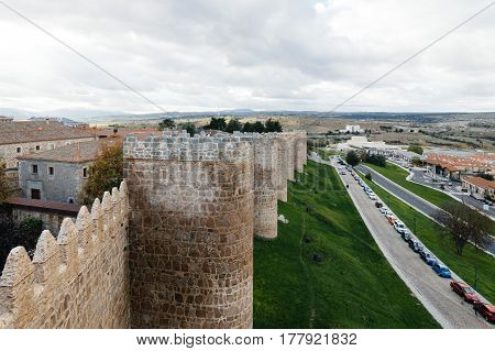 Avila Spain - November 11 2014: The Medieval Walls of Avila. The old city and its extramural churches were declared a World Heritage site by UNESCO