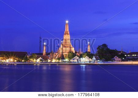 Wat Arun Temple in twilight time located near Chao Phraya River famous tourist attraction of Bangkok Thailand