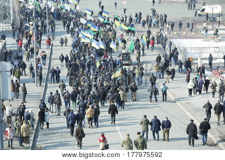 Crowd of people walking on busy city street