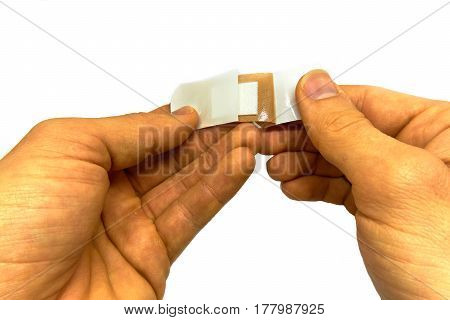 man attaching a plaster isolated on white background