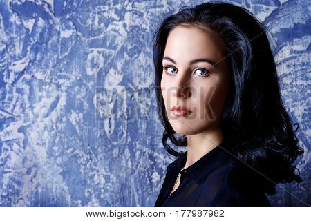 Portrait of a beautiful young woman with brunette hair. Beauty, fashion concept. Cosmetics.