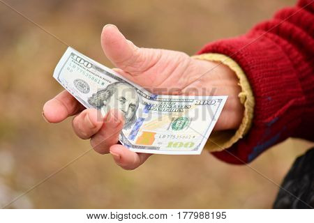 Senior Woman Is Holding Money In Her Hand. Money In Old Womans Hand