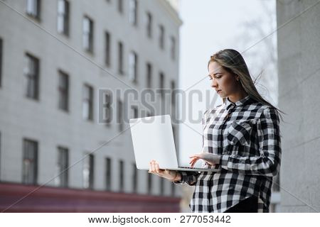Smart Young Female Person And Front Open Laptop Computer With Empty Space For Your Information Or Co