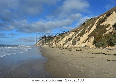 Beautiful Beach With Tall Cliffs And Sand In California