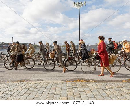 Stockholm - Sept 22, 2018: Group Of People Wearing Old Fashioned Tweed Clothes Cycling In The Bike I