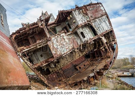 Huge Rusty Pieces Of Decommissioned Marine Ship That Was Cut And Left On The Shore.