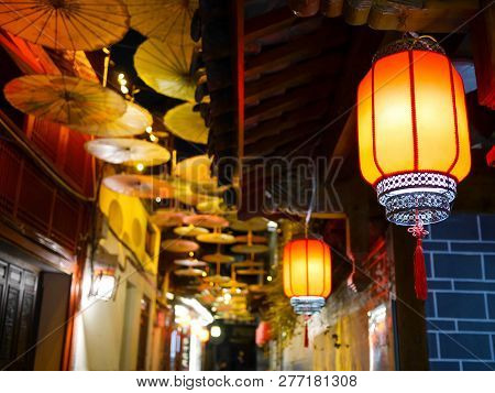 Illuminated Chinese Lanterns And Decorative Chinese Oil-paper Umbrellas In The Old Town Of Lijiang, 