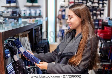 Woman Searchin For Cothes Gift In A Store Supermarket Shop