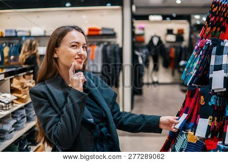 Woman Searchin For Cothes Gift In A Store Supermarket Shop