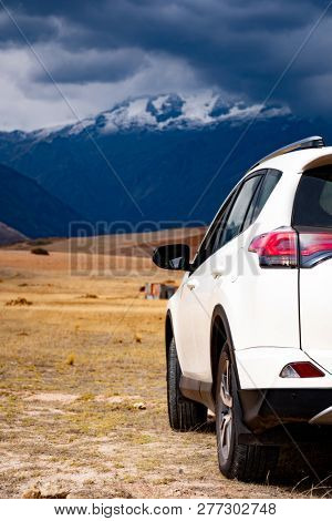 White car back view on mountanious background