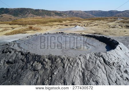 Mud Volcano With Lava Exiting From Him In National Park Of The Mud Volcanoes, Berca, Romania.