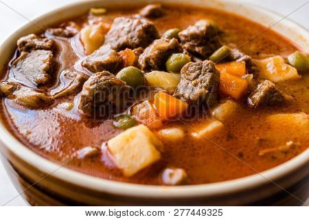 Tasty Hungarian Hot Goulash Soup Bograch Or Gulas Lamb Meat Stew With Whole Grain Bread On Wooden Su