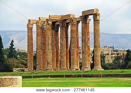 The Huge Archeological Column Ruins Of The Temple Of Olymian Zaus In Athens, Greece With Blue Sky Co