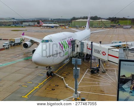 London Gatwick, Uk - December 23rd, 2018: Wamos Air Boeing 747 Being Prepared For Service At An Airp