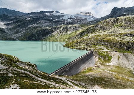 Scenic View Of Dam In Weissee In Alps