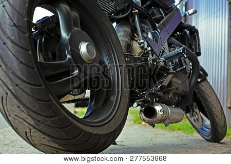 Cropped Close Up Shot Of Beautiful And Custom Made Motorcycle Parked On The Street