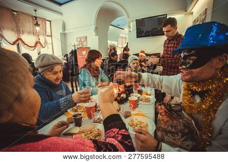 Kyiv, Ukraine - Jan 7: Many Poor People Celebrating Holidays And Having Food At Christmas Charity Di