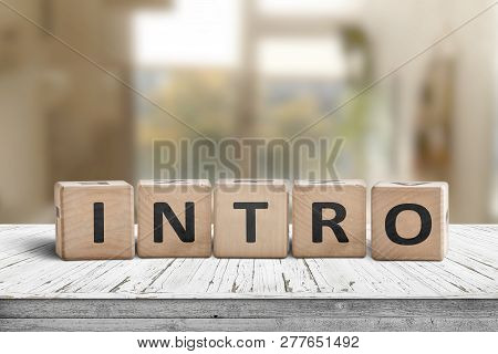 Intro Sign Made With Wooden Cubes In A Bright Room On A Table