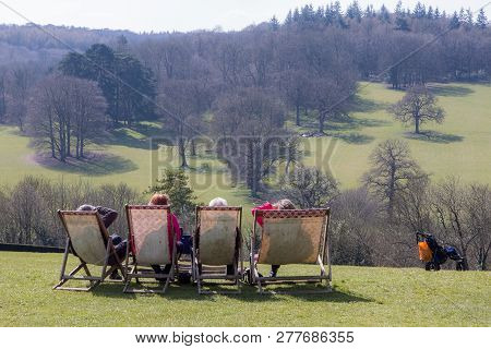 Grandparents Day Out. Pensioners On Vacation In The Countryside. Four Elderly People Sitting On Deck