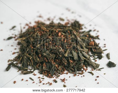 Trendy Drink Idea: Tea-coffee Blend Combines Two Popular Drinks. Heap Of Dry Mix Of Green Tea And Gr