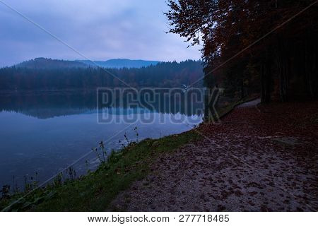 Lake Laghi Di Fusine With Beautiful Reflections On A Rainy Evening Near Tarvisio In Italy, Europe